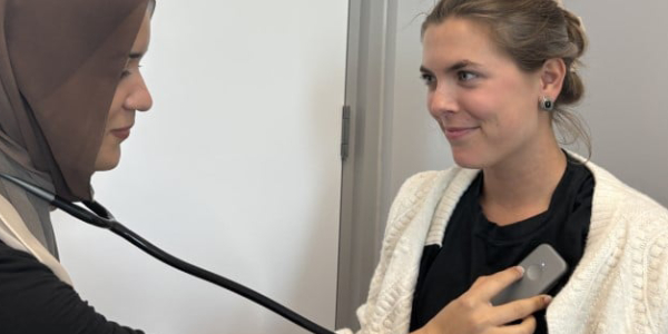 Two women using AI stethoscope